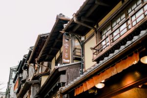 Classic wooden structures in a Japanese market street, showcasing traditional architecture.