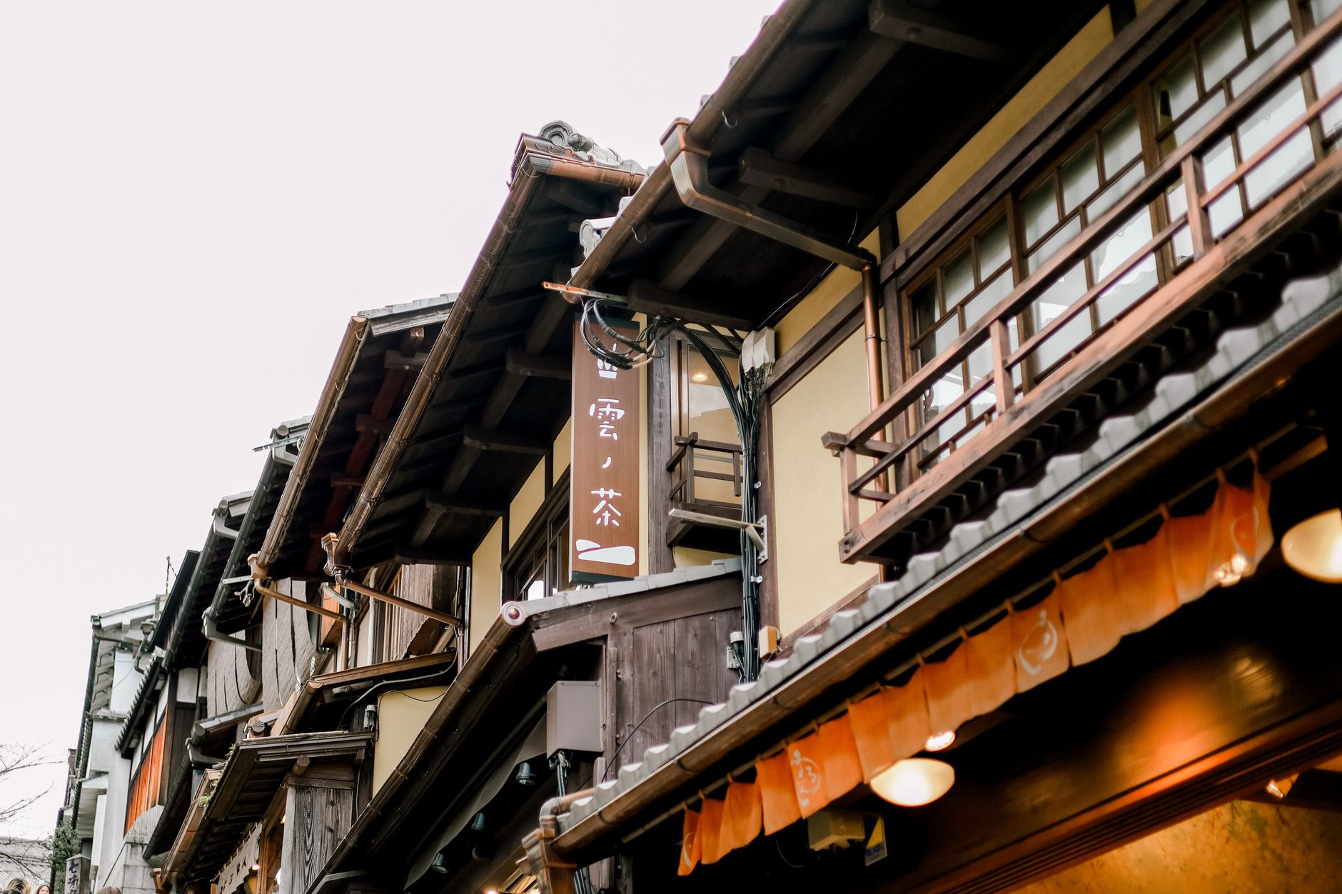 Classic wooden structures in a Japanese market street, showcasing traditional architecture.