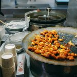 Experience the vibrant culinary scene of Seoul with this close-up of sizzling Korean street food.